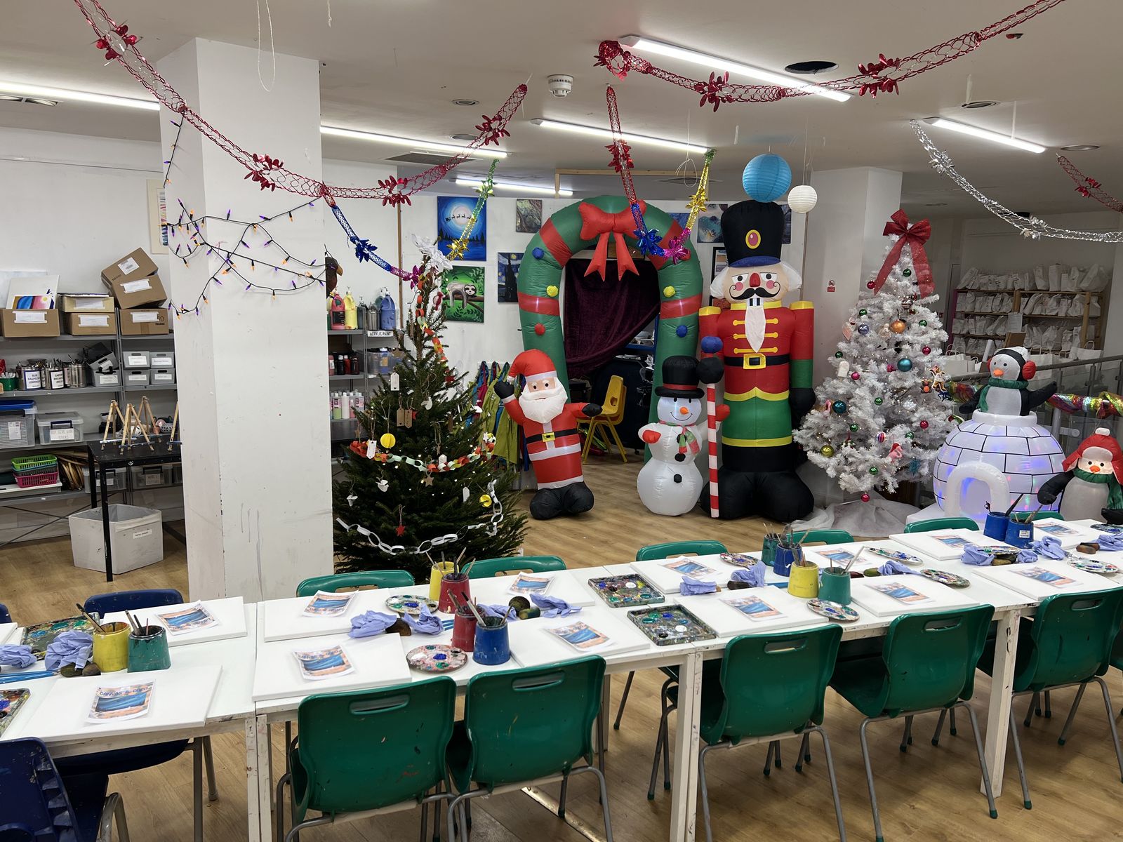 The studio dressed for Christmas with trees, nutcrackers and tables laid ready for a workshop